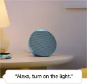 Amazon Echo Pop is placed on the Table